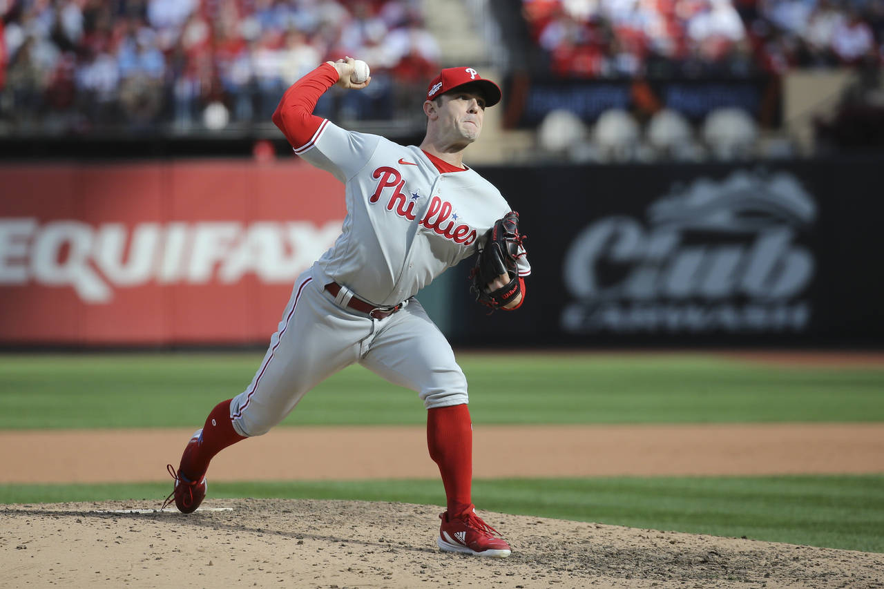 Philadelphia Phillies' David Robertson throws during the eighth inning in Game 1 of a National Leag...