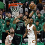 
              Boston Celtics' Jayson Tatum goes to the basket past Cleveland Cavaliers' Dean Wade during the first quarter of an NBA basketball game Friday, Oct. 28, 2022, in Boston. (AP Photo/Winslow Townson)
            