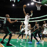 
              Cleveland Cavaliers' Donovan Mitchell (45) goes in for a dunk over Boston Celtics' Marcus Smart during the second quarter of an NBA basketball game Friday, Oct. 28, 2022, in Boston. (AP Photo/Winslow Townson)
            