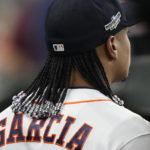 
              Houston Astros pitcher Luis Garcia looks out toward the field before Game 1 of an American League Division Series baseball game against the Seattle Mariners in Houston, Tuesday, Oct. 11, 2022. Garcia and teammate Framber Valdez got hair extensions this season and will show off their unique locks this postseason as Houston tries to reach the World Series for the fourth time in six years. (AP Photo/David J. Phillip)
            