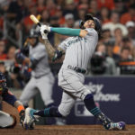 
              Seattle Mariners' J.P. Crawford loses his helmet on a strikle swing during the ninth inning in Game 2 of an American League Division Series baseball game against the Houston Astros in Houston, Thursday, Oct. 13, 2022. (AP Photo/David J. Phillip)
            