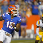 
              Florida quarterback Anthony Richardson (15) looks for a receiver as he is chased by LSU safety Jay Ward (5) during the first half of an NCAA college football game, Saturday, Oct. 15, 2022, in Gainesville, Fla. (AP Photo/John Raoux)
            
