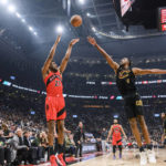 
              Toronto Raptors forward Thaddeus Young (21) shoots over Cleveland Cavaliers centre Evan Mobley (4) during the first half of an NBA basketball game Wednesday, Oct. 19, 2022, in Toronto. (Christopher Katsarov/The Canadian Press via AP)
            