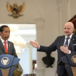 
              FIFA President Gianni Infantino, right, gestures at Indonesian President Joko Widodo during a press conference after their meeting at Merdeka Palace in Jakarta, Indonesia, Tuesday, Oct. 18, 2022. (AP Photo/Achmad Ibrahim)
            