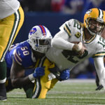 
              Buffalo Bills defensive end Greg Rousseau (50) sacks Green Bay Packers quarterback Aaron Rodgers (12) during the first half of an NFL football game Sunday, Oct. 30, 2022, in Orchard Park. (AP Photo/Adrian Kraus)
            