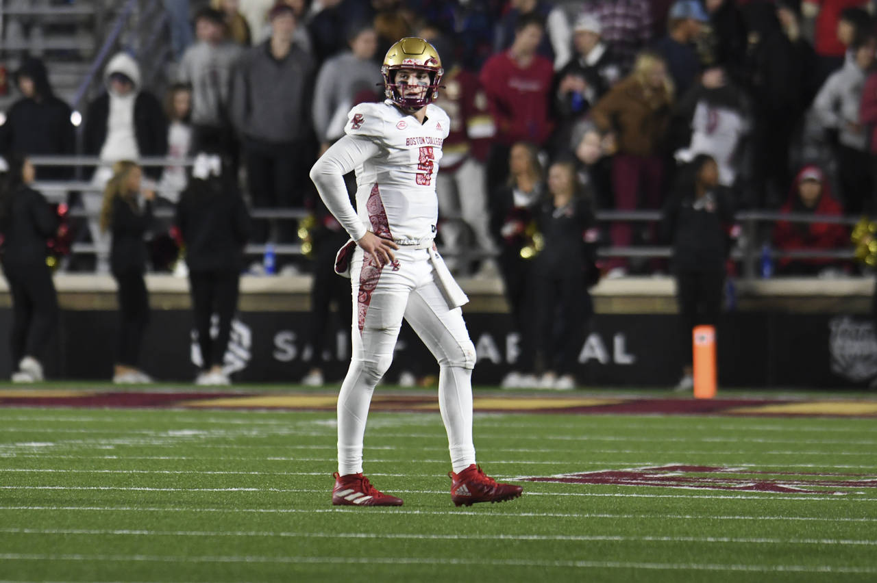 Boston College quarterback Phil Jurkovec walks off the field after a receiver fumbled the ball duri...