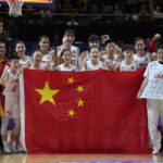 
              Players from China celebrate with former NBA start Yao Ming, fourth left, after winning silver medal in the final game against the United States at the women's Basketball World Cup in Sydney, Australia, Saturday, Oct. 1, 2022. (AP Photo/Rick Rycroft)
            