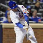 
              New York Mets Pete Alonso connects for a solo home run against the San Diego Padres during the fifth inning of Game 2 of a National League wild-card baseball playoff series, Saturday, Oct. 8, 2022, in New York. (AP Photo/John Minchillo)
            