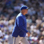 
              FILE - Kansas City Royals pitching coach Cal Eldred in the seventh inning of a baseball game, May 15, 2022, in Denver. Eldred and team manager Mike Matheny were fired by the Royals on Wednesday, Oct. 5, 2022, night shortly after the struggling franchise finished the season 65-97 with a listless 9-2 loss to the Cleveland Guardians. (AP Photo/David Zalubowski, File)
            