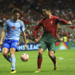 
              FILE - Portugal's Cristiano Ronaldo, right, challenges for the ball with Spain's Pau Torres during the UEFA Nations League soccer match between Portugal and Spain at the Municipal Stadium in Braga, Portugal, Tuesday, Sept. 27, 2022. (AP Photo/Luis Vieira, File)
            