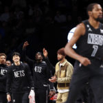 
              Brooklyn Nets teammates react after Brooklyn Nets forward Kevin Durant (7) makes a three point shot against the Indiana Pacers during the first half of an NBA basketball game Monday, Oct. 31, 2022, in New York. (AP Photo/Jessie Alcheh)
            