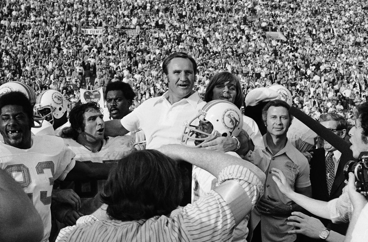 FILE - Miami Dolphins head coach Don Shula, center, is carried off the field after his team won the...