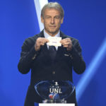 
              Juergen Klinsmann, former soccer player and soccer official, holds the lot of Spainduring the draw for the groups to qualify for the 2024 European soccer championship in Frankfurt, Germany, Sunday, Oct.9, 2022.  (Arne Dedert/dpa via AP)
            
