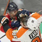 
              Philadelphia Flyers left wing Joel Farabee (86) and Florida Panthers center Colin White (6) scuffle during the second period of an NHL hockey game, Wednesday, Oct. 19, 2022, in Sunrise, Fla. (AP Photo/Wilfredo Lee )
            