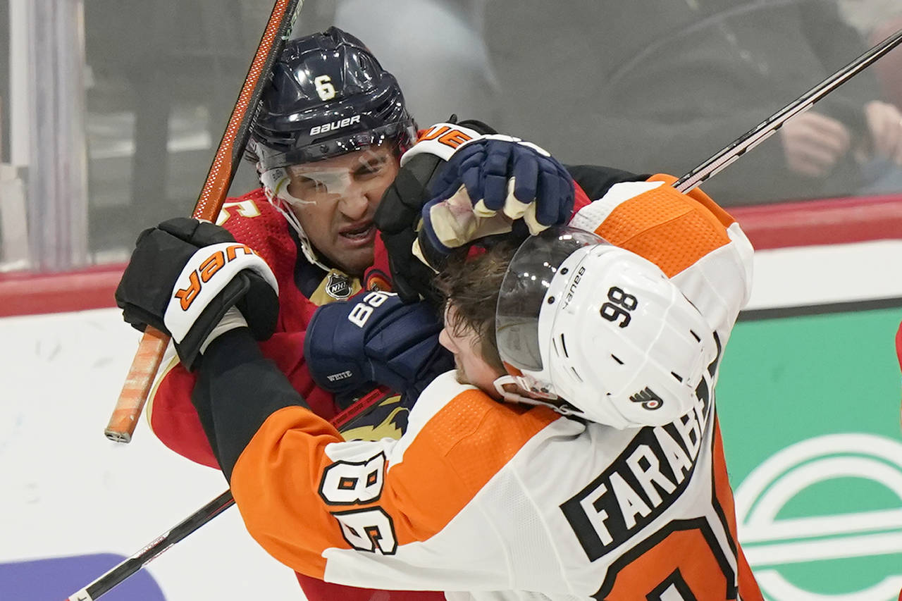 Philadelphia Flyers left wing Joel Farabee (86) and Florida Panthers center Colin White (6) scuffle...