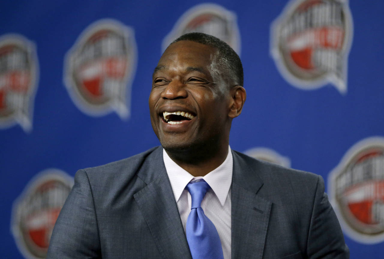 FILE - Former NBA basketball player Dikembe Mutombo laughs during a news conference announcing him ...