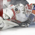 
              Florida Panthers goaltender Sergei Bobrovsky stops a shot by New York Islanders right wing Nikita Soshnikov during the second period of an NHL hockey game Thursday, Oct. 13, 2022, in Elmont, N.Y. (AP Photo/Adam Hunger)
            