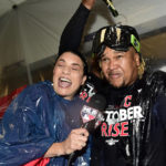 
              Cleveland Guardians' Jose Ramirez has champagne poured over him as he speaks with MLB reporter Alanna Rizzo, left, as he celebrates in the locker room after defeating the Tampa Bay Rays in the wild card baseball playoff game, Saturday, Oct. 8, 2022, in Cleveland. (AP Photo/David Dermer)
            