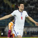 
              FILE - England's Harry Maguire celebrates after scoring his side's opening goal during the World Cup 2022 group I qualifying soccer match between San Marino and England at Olympic Stadium, in Serravalle, San Marino, Monday, Nov. 15, 2021. (AP Photo/Antonio Calanni, File)
            
