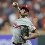 
              Philadelphia Phillies starting pitcher Aaron Nola throws during the first inning in Game 1 of baseball's World Series between the Houston Astros and the Philadelphia Phillies on Friday, Oct. 28, 2022, in Houston. (AP Photo/Eric Gay)
            