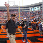
              Oklahoma State head coach Mike Gundy waves to the crowd after an NCAA college football game against Texas Tech in Stillwater, Okla., Saturday, Oct. 8, 2022. (AP Photo/Mitch Alcala)
            