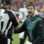 
              Philadelphia Eagles head coach Nick Sirianni speaks with an official during the second half an NFL football game against the Arizona Cardinals, Sunday, Oct. 9, 2022, in Glendale, Ariz. (AP Photo/Rick Scuteri)
            
