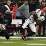 
              Cincinnati Bengals wide receiver Ja'Marr Chase (1) breaks the tackle of New Orleans Saints cornerback Bradley Roby (21) and runs for a touchdown during the second half of an NFL football game in New Orleans, Sunday, Oct. 16, 2022. (AP Photo/Gerald Herbert)
            