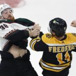 
              Boston Bruins' Trent Frederic (11) and Arizona Coyotes' Liam O'Brien (38) fight during the second period of an NHL hockey game, Saturday, Oct. 15, 2022, in Boston. (AP Photo/Michael Dwyer)
            