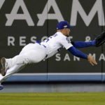 
              Los Angeles Dodgers left fielder Trayce Thompson can't get to a ball hit for a double by San Diego Padres' Ha-Seong Kim during the fifth inning in Game 1 of a baseball NL Division Series Tuesday, Oct. 11, 2022, in Los Angeles. (AP Photo/Marcio Jose Sanchez)
            