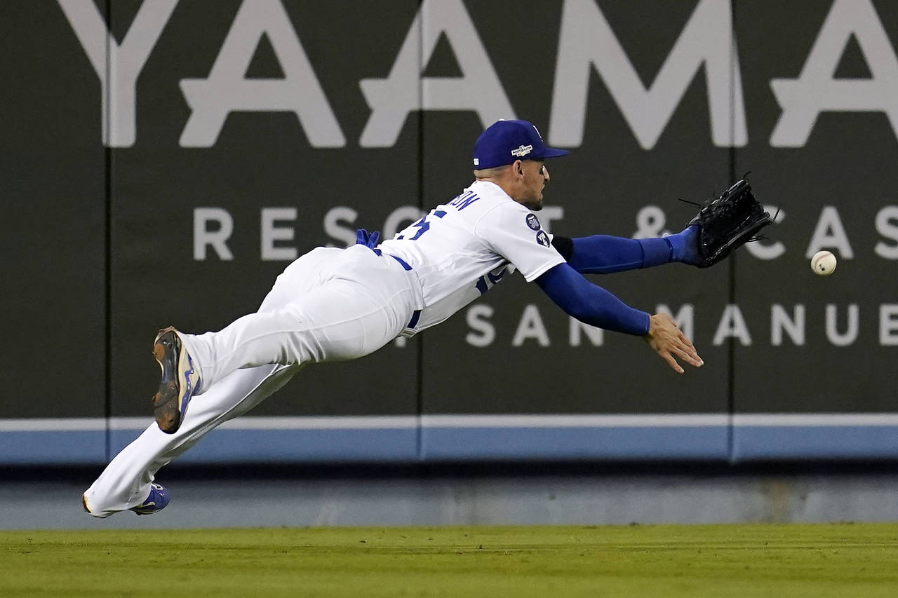 San Diego Padres' Trent Grisham reacts after hitting a home run during the  fourth inning in Game 3 of a baseball NL Division Series against the Los  Angeles Dodgers, Friday, Oct. 14