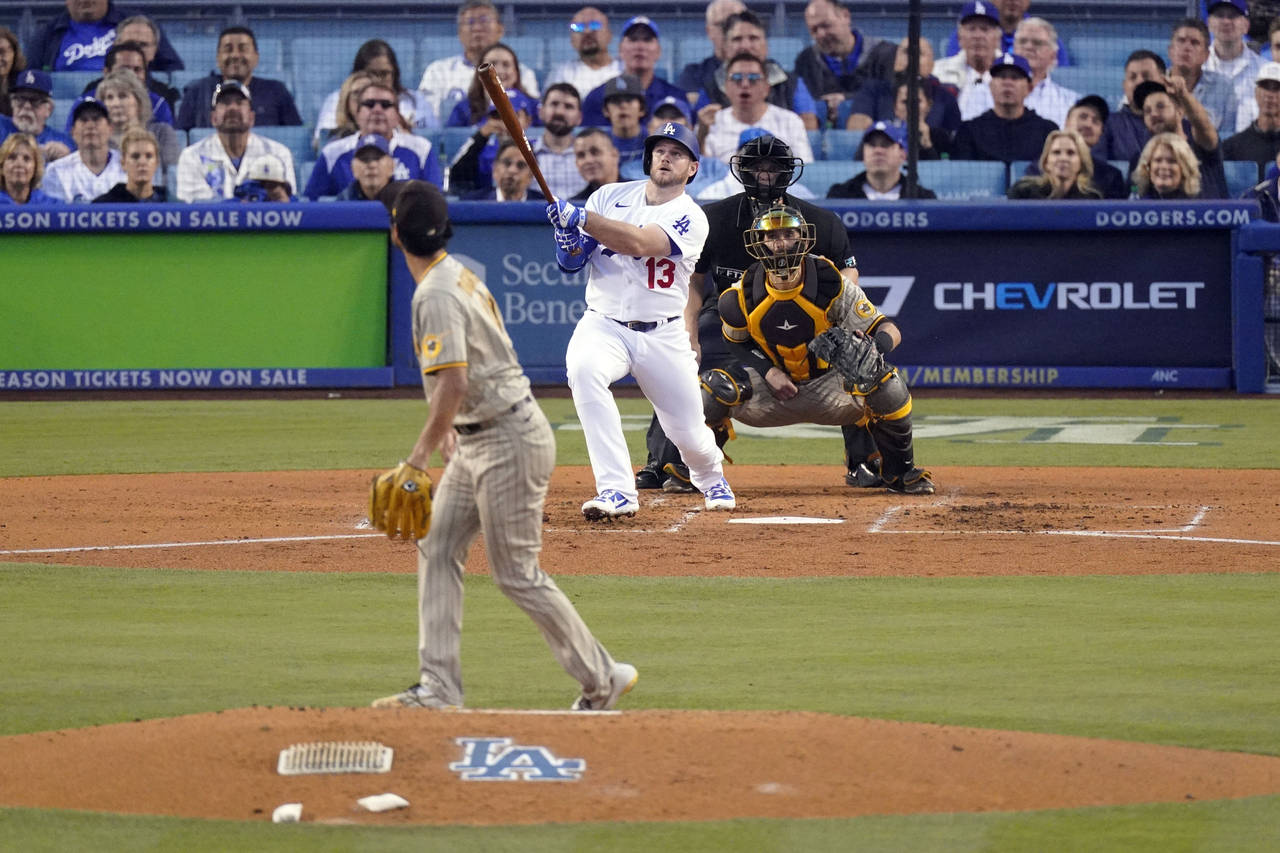 Los Angeles Dodgers' Max Muncy connects for a solo home run during the second inning in Game 2 of a...
