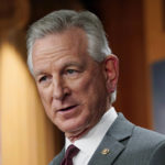 
              FILE - Sen. Tommy Tuberville, R-Ala., listens to question during a news conference March 30, 2022, in Washington. Tuberville told people at an election rally Saturday, Oct. 8, in Nevada that Democrats support reparations for the descendants of enslaved people because “they think the people that do the crime are owed that.” His remarks — seen by many as racist and stereotyping Black Americans as people committing crimes — cut deeply for some, especially in and around Africatown, a community in Mobile, Ala., that was founded by descendants of Africans who were illegally smuggled into the United States in 1860 aboard a schooner called the Clotilda. (AP Photo/Mariam Zuhaib, File)
            