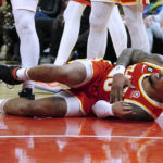 
              Atlanta Hawks forward John Collins reacts after being fouled during the second half of the team's NBA basketball game against the Houston Rockets on Wednesday, Oct. 19, 2022, in Atlanta. Collins remained in the game. (AP Photo/John Bazemore)
            
