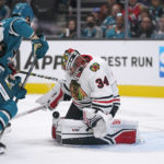 
              Chicago Blackhawks goaltender Petr Mrazek (34) stops a San Jose Sharks shot during the first period of an NHL hockey game in San Jose, Calif., Saturday, Oct. 15, 2022. (AP Photo/Godofredo A. Vásquez)
            