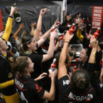 
              The Portland Thorns FC celebrate in the locker room after the NWSL championship soccer match against the Kansas City Current, Saturday, Oct. 29, 2022, in Washington. Portland won 2-0. (AP Photo/Nick Wass)
            