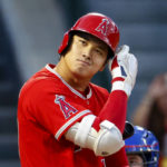 
              Los Angeles Angels' Shohei Ohtani checks his batting helmet during his at-bat in the first inning of the team's baseball game against the Texas Rangers in Anaheim, Calif., Saturday, Oct. 1, 2022. (AP Photo/Ringo H.W. Chiu)
            