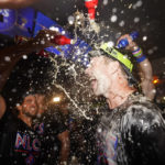 
              Philadelphia Phillies first baseman Rhys Hoskins is doused after a win over the Atlanta Braves in Game 4 of baseball's National League Division Series, Saturday, Oct. 15, 2022, in Philadelphia. The Philadelphia Phillies won, 8-3. (AP Photo/Matt Slocum)
            