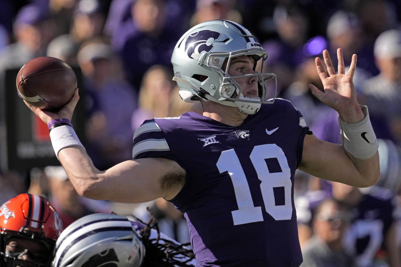 Kansas State quarterback Will Howard throws during the first half of an NCAA college football game ...