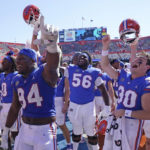 
              Florida players celebrate in front of fans after defeating Missouri in an NCAA college football game, Saturday, Oct. 8, 2022, in Gainesville, Fla. (AP Photo/John Raoux)
            
