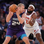 
              New York Knicks center Mitchell Robinson (23) defends against Charlotte Hornets center Mason Plumlee (24) during the first half of an NBA basketball game in New York. Wednesday, Oct. 26, 2022. (AP Photo/Noah K. Murray)
            