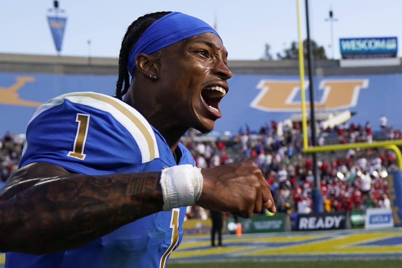 UCLA quarterback Dorian Thompson-Robinson (1) reacts after a 42-32 win over Utah in an NCAA college...