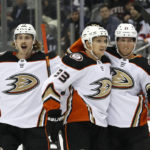 
              Anaheim Ducks right wing Jakob Silfverberg (33) celebrates with Simon Benoit (13) and Isac Lundestrom (21) after scoring a goal against the New Jersey Devils during the first period of an NHL hockey game Tuesday, Oct. 18, 2022, in Newark, N.J. (AP Photo/Noah K. Murray)
            