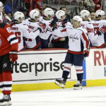 
              Washington Capitals left wing Conor Sheary (73) celebrates with teammates after scoring a goal in the second period of an NHL hockey game against the New Jersey Devils, Monday, Oct. 24, 2022, in Newark, N.J. (AP Photo/Adam Hunger)
            