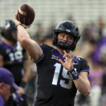 
              TCU quarterback Max Duggan (15) warms up before an NCAA college football game against Kansas State, Saturday, Oct. 22, 2022, in Fort Worth, Texas. (AP Photo/Richard W. Rodriguez)
            