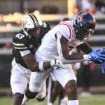 
              Mississippi tight end Michael Trigg is caught from behind by Vanderbilt linebacker De'Rickey Wright (43) during the second half of an NCAA college football game Saturday, Oct. 8, 2022, in Nashville, Tenn. Mississippi won 52-28. (AP Photo/John Amis)
            