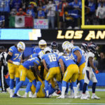 
              Los Angeles Chargers help up place kicker Dustin Hopkins (6) after he kicked the game-winning field goal against the Denver Broncos during the second half of an NFL football game, Monday, Oct. 17, 2022, in Inglewood, Calif. (AP Photo/Marcio Jose Sanchez)
            