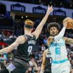 
              Charlotte Hornets forward Jalen McDaniels (6) drives the lane against Sacramento Kings guard Kevin Huerter (9) during the first half of an NBA basketball game Monday, Oct. 31, 2022, in Charlotte, N.C. (AP Photo/Rusty Jones)
            