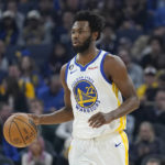 
              Golden State Warriors forward Andrew Wiggins (22) brings the ball up the court against the Miami Heat during the first half of an NBA basketball game in San Francisco, Thursday, Oct. 27, 2022. (AP Photo/Jeff Chiu)
            