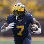 
              Michigan running back Donovan Edwards runs the ball against Penn State in the second half of an NCAA college football game in Ann Arbor, Mich., Saturday, Oct. 15, 2022. (AP Photo/Paul Sancya)
            
