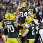 
              Green Bay Packers place kicker Mason Crosby (2) celebrates with teammates after kicking a 31-yard field goal during overtime in an NFL football game against the New England Patriots, Sunday, Oct. 2, 2022, in Green Bay, Wis. The Packers won 27-24. (AP Photo/Matt Ludtke)
            